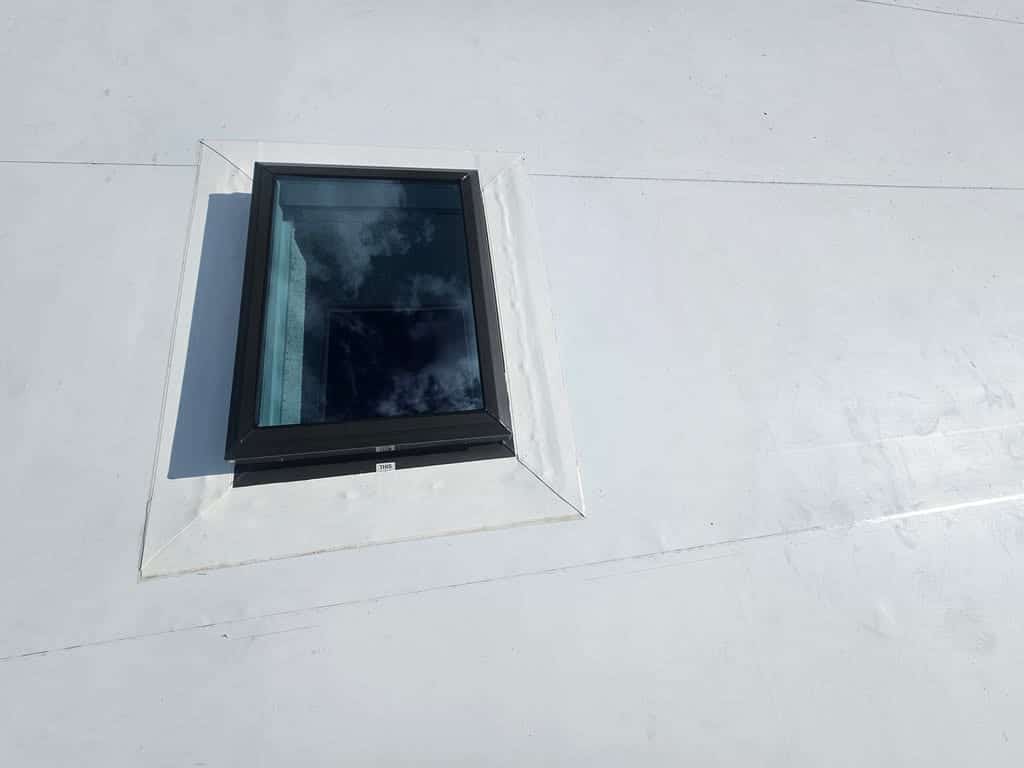 Step 1 White drip edge over perimeter wood, then TPO over wood perimeter and cut TPO Opening for daylight. #2 Water-Block Mastic under flange. #3 Screw skylight down with 3" screws then Silicone sealant around flange and screw heads. #4 Apply TPO primer and coverstrip. Triple watertight protection.