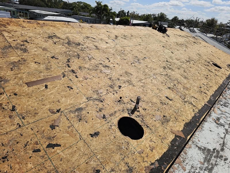 Old roofing torn off down to clean bare wood decking, ready for new underlayment